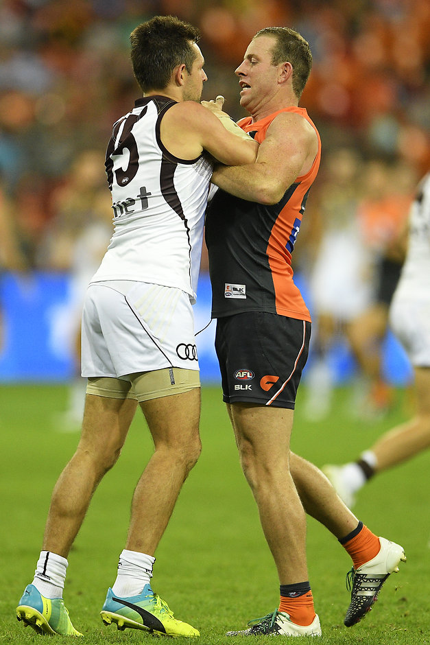 AFL Rd 06 - GWS v Hawthorn SYDNEY, AUSTRALIA - APRIL 30: Steve Johnson of the Giants and Luke Hodge of the Hawks wrestle during the round six AFL match between the Greater Western Sydney Giants and the Hawthorn Hawks at Spotless Stadium on April 30, 2016 in Sydney, Australia. (Photo by Brett Hemmings/AFL Media/Getty Images)